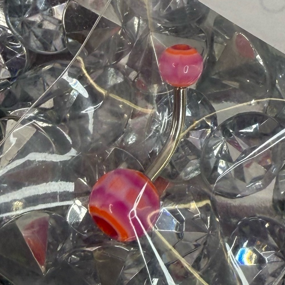 Bellybutton ring piercing brand new purple pink orange swirls